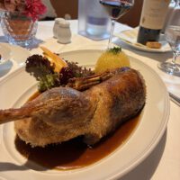 Half a Bavarian roast duck with gravy, potato dumplings and red cabbage at the Hotel Restaurant Erber in Ismaning